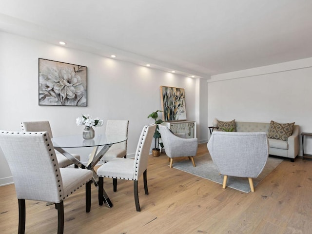 1355 N Sandburg Ter Unit 906D, Chicago, IL 60610 - dining area featuring light wood-style flooring, baseboards, and recessed lighting