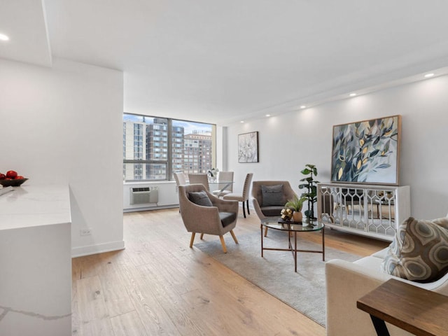 1355 N Sandburg Ter Unit 906D, Chicago, IL 60610 - living area featuring wood finished floors, recessed lighting, and a city view