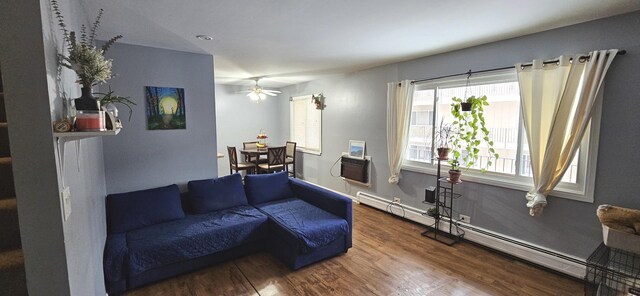 2508 Algonquin Rd Unit 5, Rolling Meadows, IL 60008 - living room featuring a baseboard heating unit, wood finished floors, and a ceiling fan