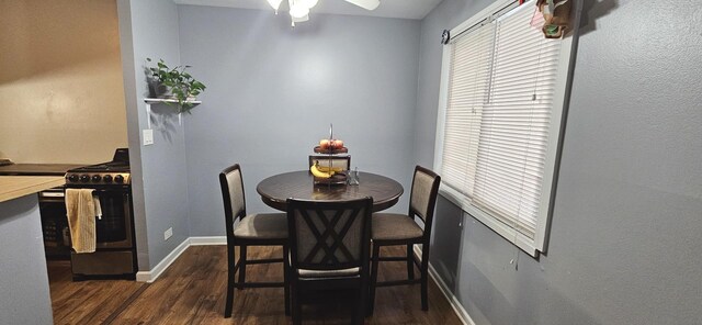 2508 Algonquin Rd Unit 5, Rolling Meadows, IL 60008 - dining area featuring dark wood-style flooring, a ceiling fan, and baseboards