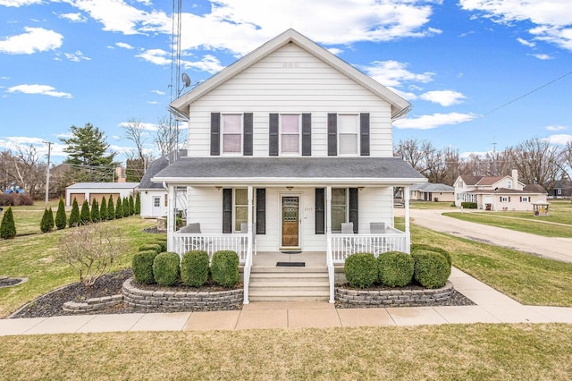 2513 Woods St, West Brooklyn, IL 61378 - view of front of home featuring covered porch, roof with shingles, and a front lawn