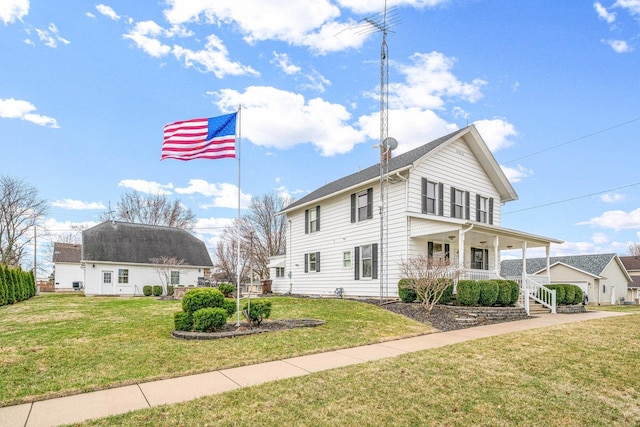 2513 Woods St, West Brooklyn, IL 61378 - view of front facade featuring covered porch and a front lawn