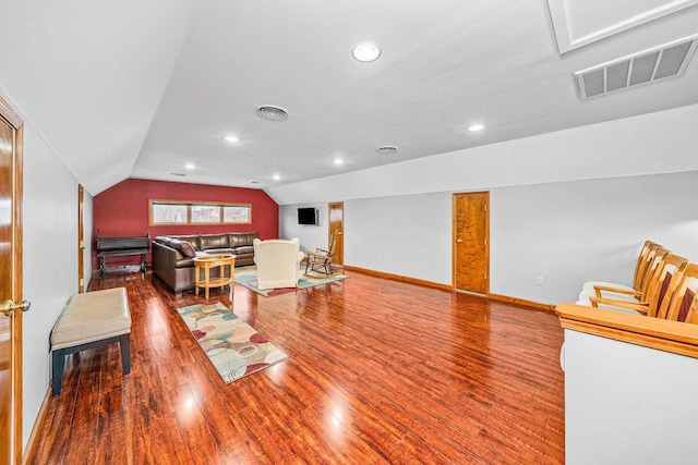 2513 Woods St, West Brooklyn, IL 61378 - living room featuring wood finished floors, baseboards, lofted ceiling, and visible vents