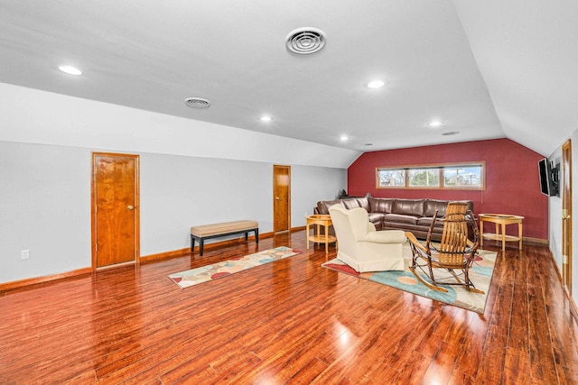 2513 Woods St, West Brooklyn, IL 61378 - living area with baseboards, visible vents, wood finished floors, and lofted ceiling