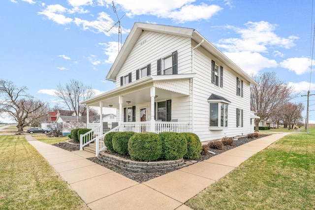 2513 Woods St, West Brooklyn, IL 61378 - view of front facade featuring a front yard and covered porch