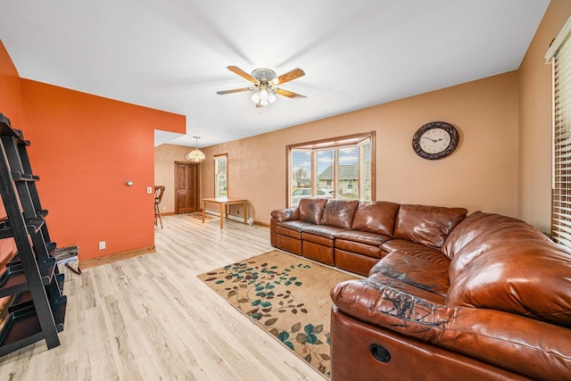2513 Woods St, West Brooklyn, IL 61378 - living area with light wood-type flooring, baseboard heating, baseboards, and ceiling fan
