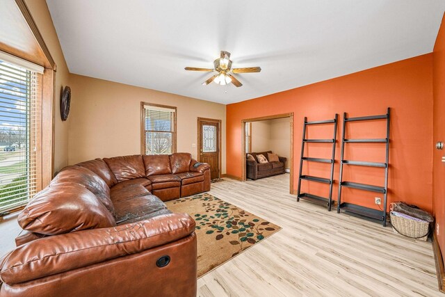 2513 Woods St, West Brooklyn, IL 61378 - living room with wood finished floors, a ceiling fan, and plenty of natural light