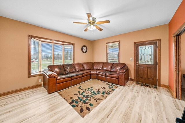 2513 Woods St, West Brooklyn, IL 61378 - living room featuring baseboards, light wood finished floors, and ceiling fan