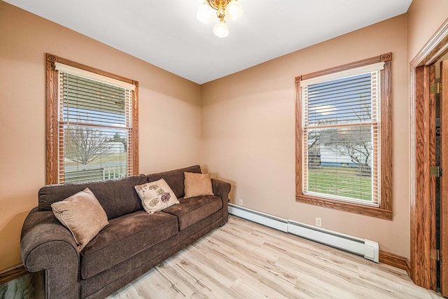 2513 Woods St, West Brooklyn, IL 61378 - living area featuring a baseboard radiator and wood finished floors