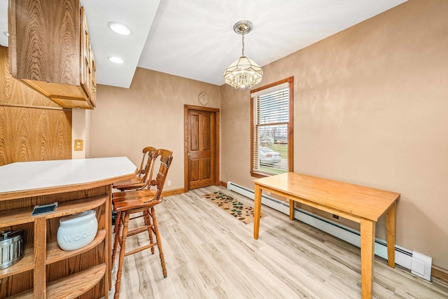 2513 Woods St, West Brooklyn, IL 61378 - dining area featuring recessed lighting, light wood-type flooring, baseboards, a notable chandelier, and baseboard heating