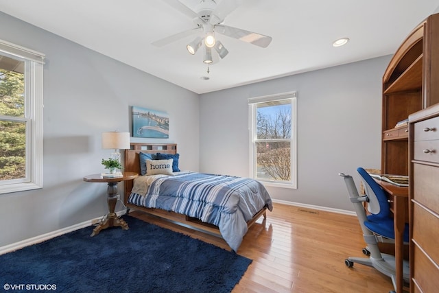 bedroom featuring baseboards, recessed lighting, a ceiling fan, and light wood finished floors