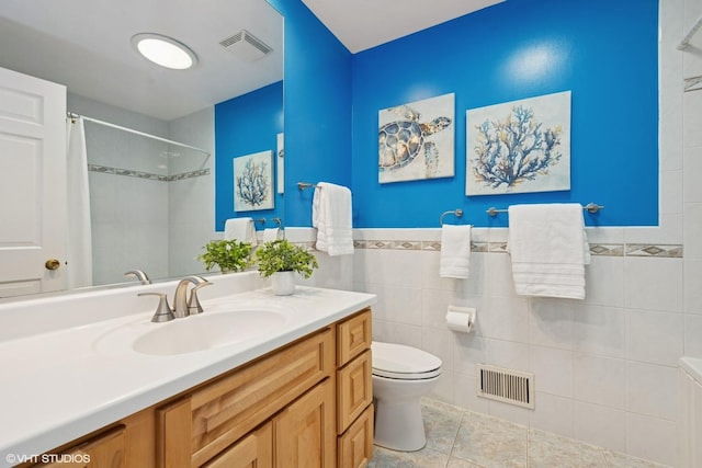 bathroom with tile walls, visible vents, toilet, and a shower with shower curtain