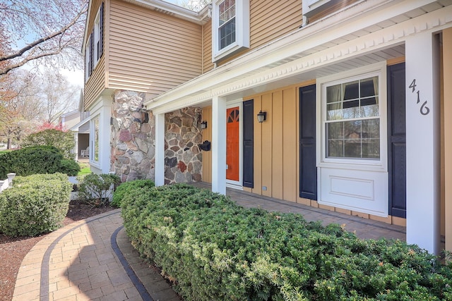 416 E Bauer Rd, Naperville, IL 60563 - entrance to property with a porch, stone siding, and board and batten siding