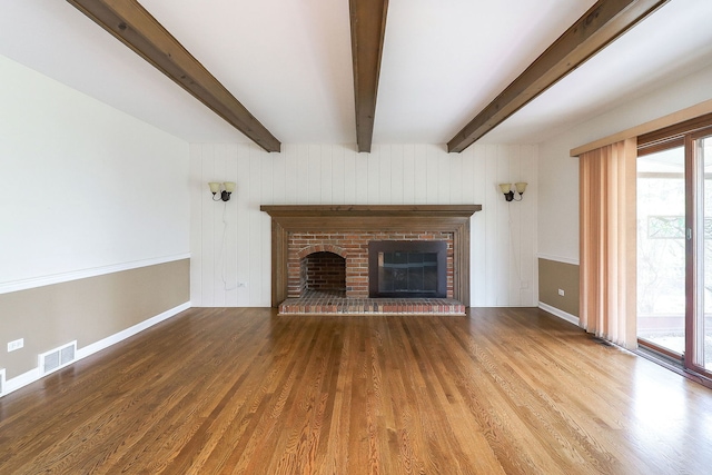 416 E Bauer Rd, Naperville, IL 60563 - unfurnished living room featuring visible vents, wood finished floors, a wealth of natural light, and beamed ceiling