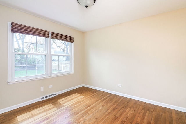416 E Bauer Rd, Naperville, IL 60563 - unfurnished room featuring visible vents, light wood-style floors, and baseboards