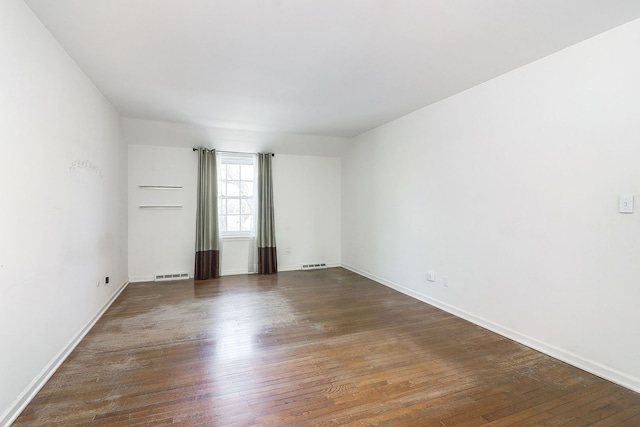 416 E Bauer Rd, Naperville, IL 60563 - empty room featuring baseboards, visible vents, and dark wood-style flooring