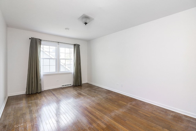 416 E Bauer Rd, Naperville, IL 60563 - empty room with visible vents, hardwood / wood-style flooring, and baseboards