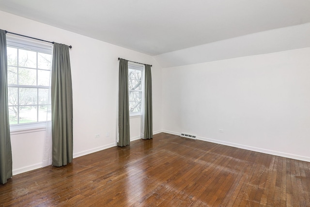 416 E Bauer Rd, Naperville, IL 60563 - empty room with wood-type flooring, visible vents, lofted ceiling, and plenty of natural light
