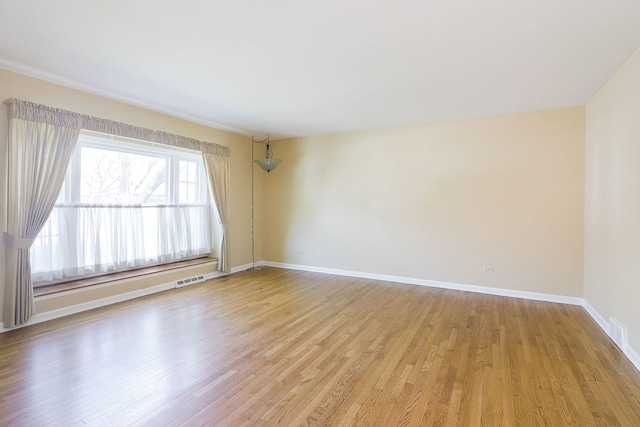 416 E Bauer Rd, Naperville, IL 60563 - unfurnished room featuring visible vents, light wood-style flooring, and baseboards