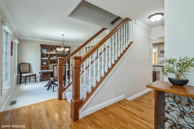 1485 Lexington Rd, Green Oaks, IL 60048 - staircase featuring a chandelier, baseboards, healthy amount of natural light, wood finished floors, and crown molding