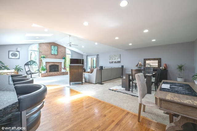 1485 Lexington Rd, Green Oaks, IL 60048 - living room featuring a ceiling fan, vaulted ceiling, wood finished floors, a fireplace, and recessed lighting