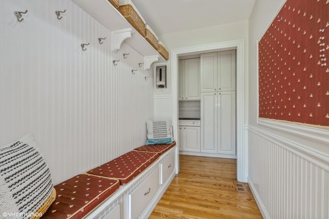 1485 Lexington Rd, Green Oaks, IL 60048 - mudroom with light wood-style floors, wainscoting, and a decorative wall