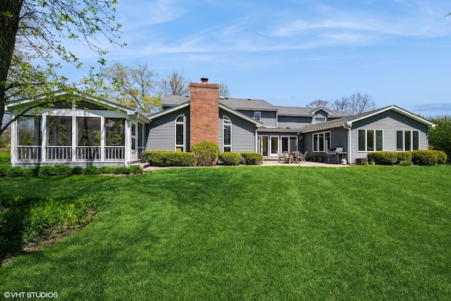 1485 Lexington Rd, Green Oaks, IL 60048 - rear view of property featuring a chimney, a patio, and a lawn