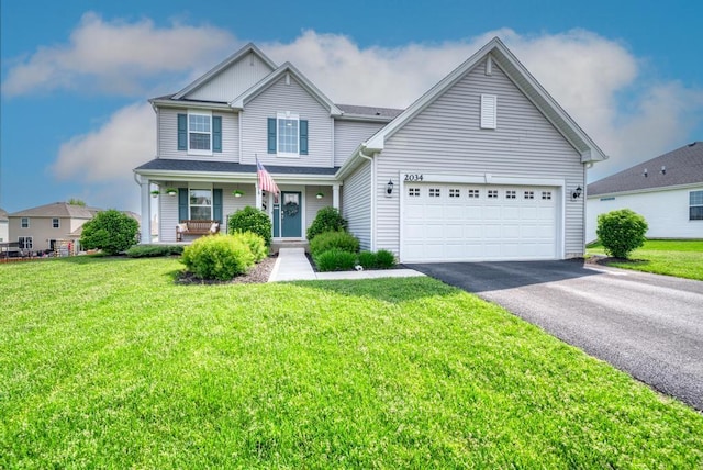 2034 Ingemunson Ln, Yorkville, IL 60560 - traditional home with asphalt driveway, covered porch, and a front lawn