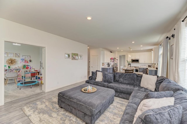 2034 Ingemunson Ln, Yorkville, IL 60560 - living area with light wood-style flooring, recessed lighting, and baseboards