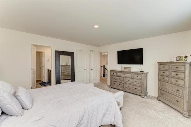2034 Ingemunson Ln, Yorkville, IL 60560 - bedroom featuring light colored carpet, ensuite bath, and baseboards
