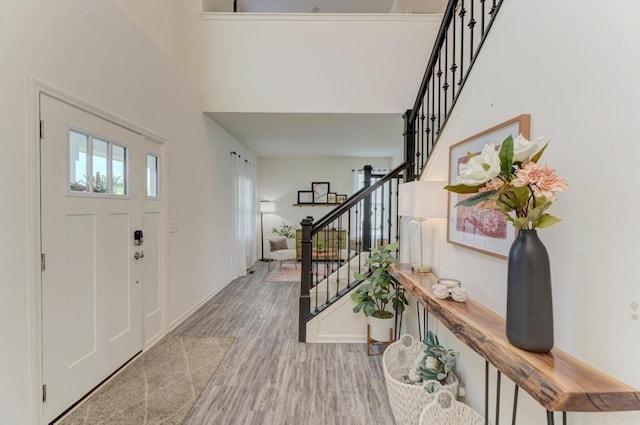 2034 Ingemunson Ln, Yorkville, IL 60560 - foyer entrance featuring wood finished floors, stairway, baseboards, and a towering ceiling