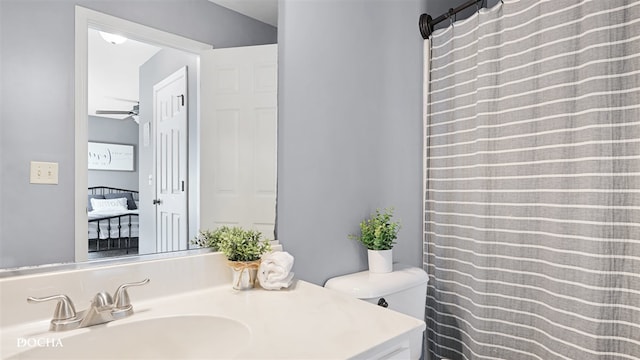 3318 Veronica St, Plano, IL 60545 - bathroom featuring toilet, vanity, a ceiling fan, and a shower with curtain