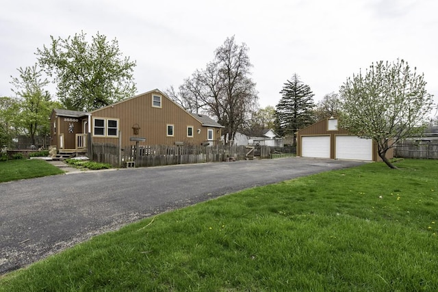 35580 N Sunnyside Ave, Ingleside, IL 60041 - view of side of home with fence private yard, a garage, and a lawn