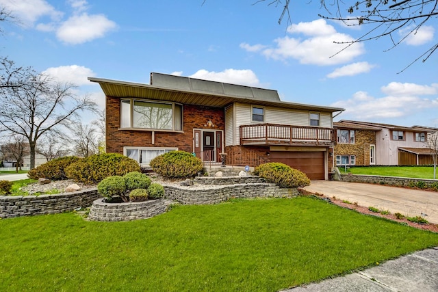 bi-level home featuring a garage, a front yard, and concrete driveway