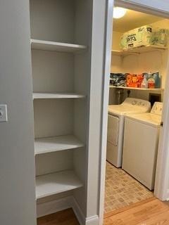 113 E Winchester Rd Unit C, Libertyville, IL 60048 - clothes washing area featuring light wood-style flooring, washer and dryer, and laundry area