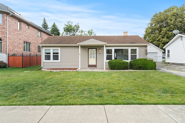 6449 W 84th St, Burbank, IL 60459 - view of front facade featuring roof with shingles, a chimney, an outdoor structure, and a detached garage