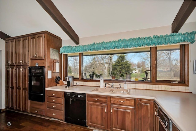145 Markev Ln, New Lenox, IL 60451 - kitchen with light countertops, dark wood-style flooring, a sink, and black appliances