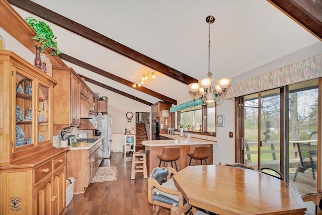 145 Markev Ln, New Lenox, IL 60451 - dining space featuring a chandelier, vaulted ceiling with beams, and dark wood-type flooring