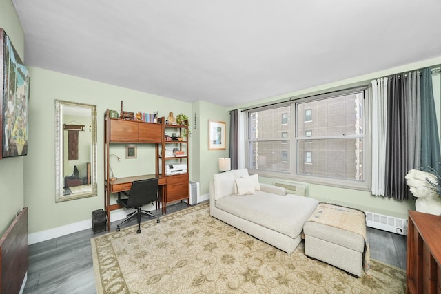 office space with wood finished floors, baseboards, and visible vents