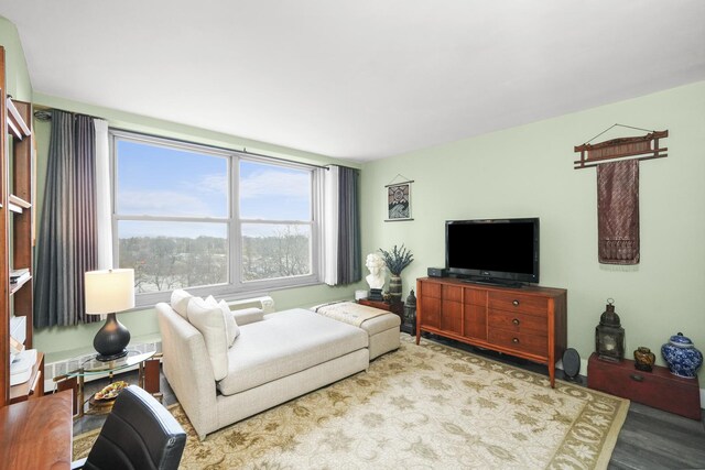 living room with wood finished floors and visible vents