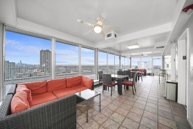 sunroom / solarium featuring a city view and visible vents