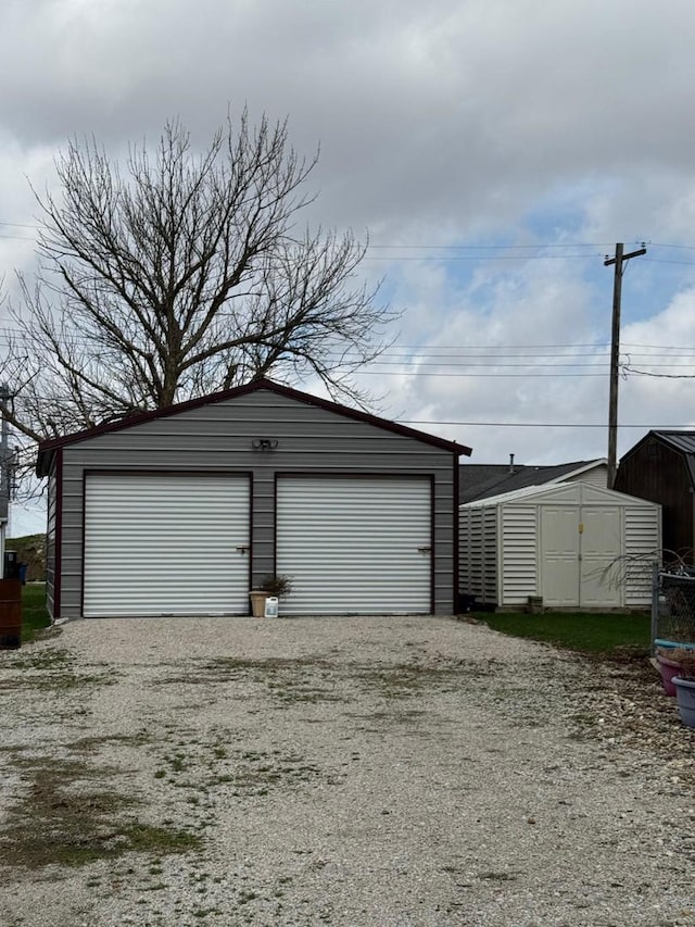 detached garage with a shed