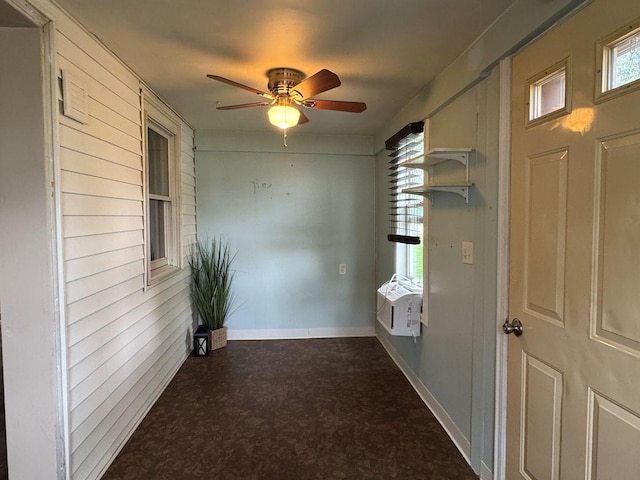 hallway featuring dark flooring