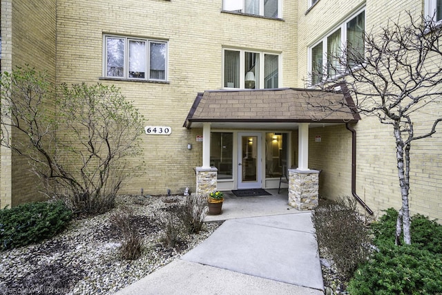 6430 W Belle Plaine Ave Unit 508, Chicago, IL 60634 - view of exterior entry with french doors and brick siding