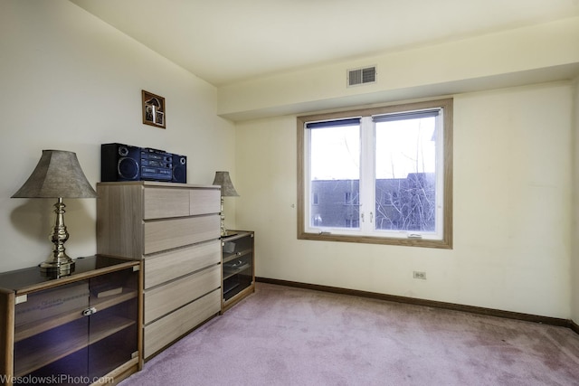 6430 W Belle Plaine Ave Unit 508, Chicago, IL 60634 - bedroom with baseboards, visible vents, and light carpet