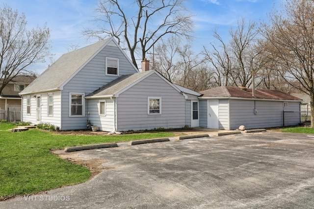 16224 Kedzie Ave, Markham, IL 60428 - back of house featuring uncovered parking, a chimney, a yard, and roof with shingles