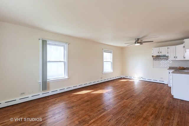 16224 Kedzie Ave, Markham, IL 60428 - unfurnished living room featuring dark wood-style floors, ceiling fan, and a baseboard heating unit