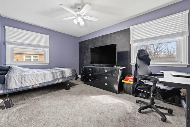 carpeted bedroom featuring a ceiling fan