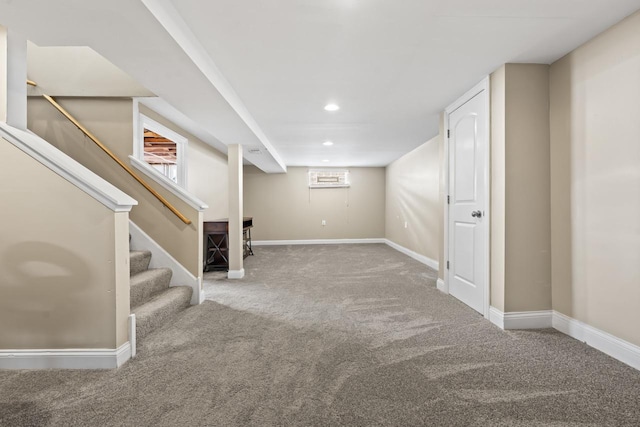basement featuring carpet flooring, baseboards, stairway, and recessed lighting