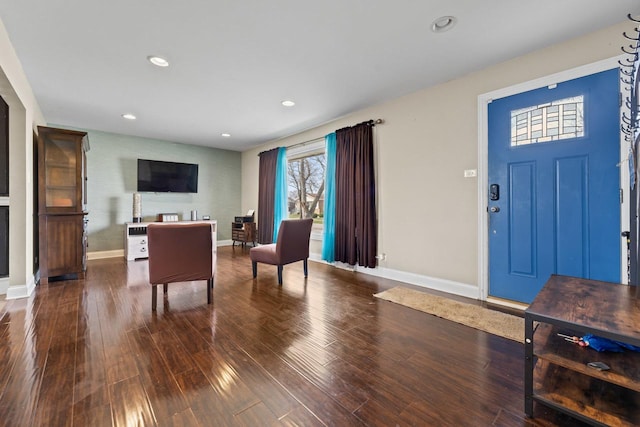 living area featuring wood finished floors, baseboards, and recessed lighting